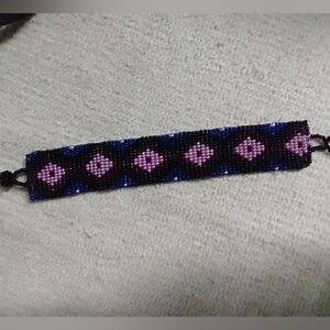 Purple pink black ethnic tribal flat beaded woven bracelet